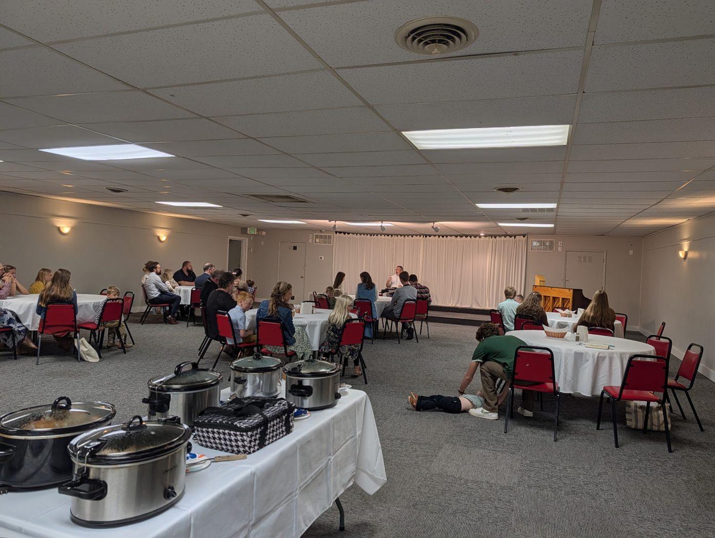 Parishioners gathered around tables for fellowship
